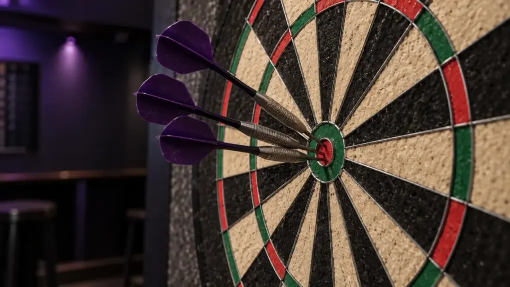 Purple-flight darts in a close view of a dartboard