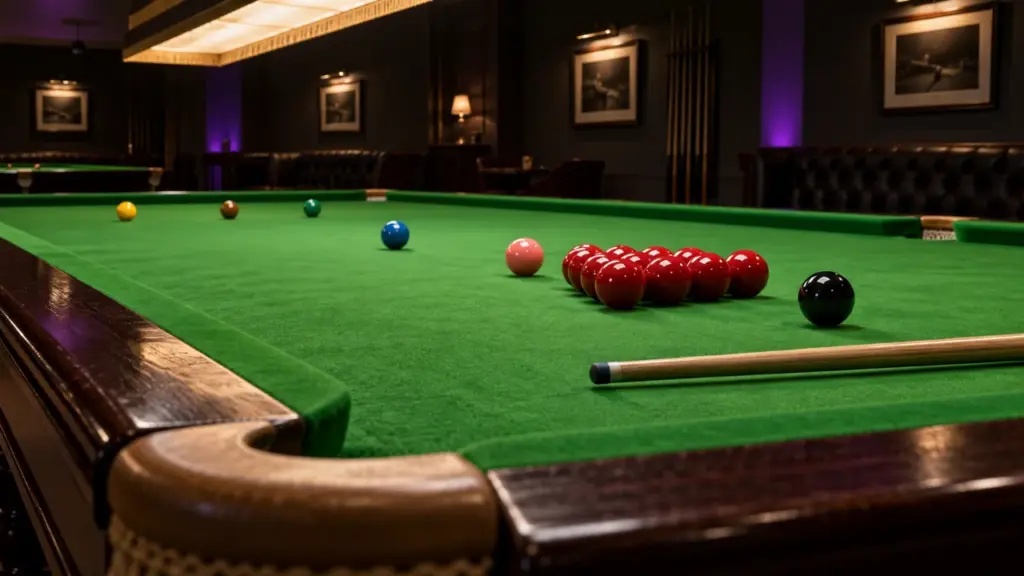 Snooker balls and a cue on a green table
